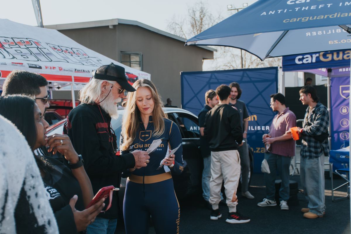 Visitors talking to the carGuardian team at the expo stand