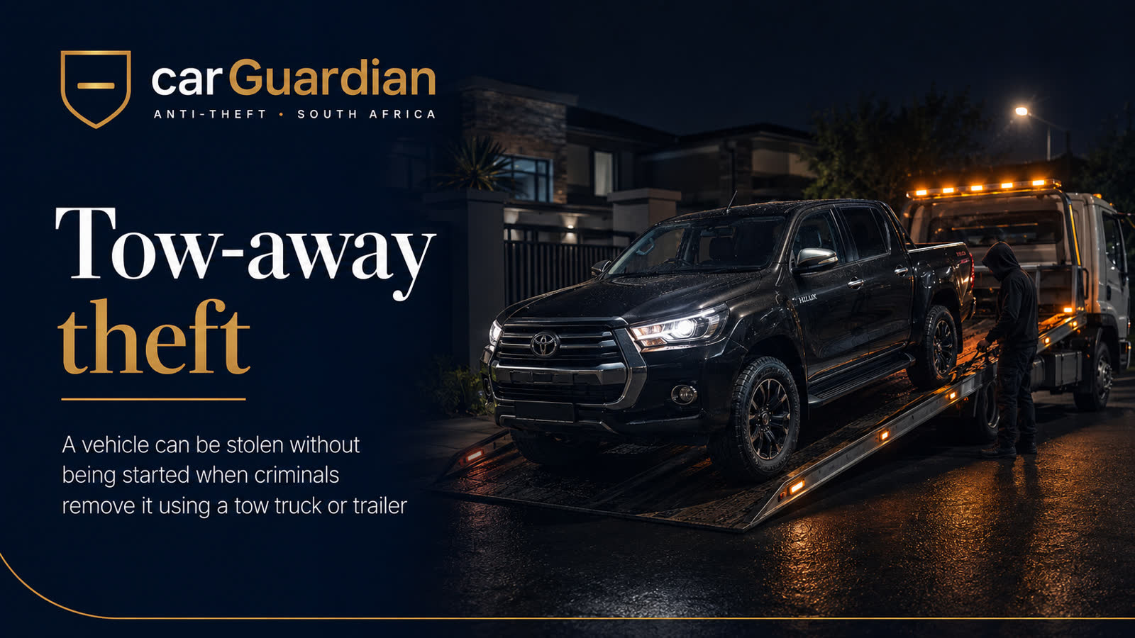Tow-away theft — a vehicle being loaded onto a flatbed truck at night